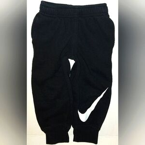 EUC Unisex NIKE Black warm Jogger pants with Large White Swoosh detail